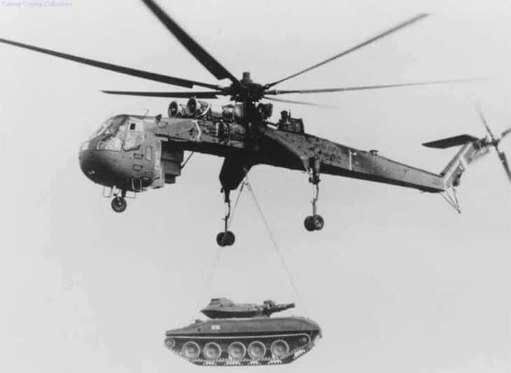 US Army heavy lift helicopter (CH-54) lifting a tank during the Vietnam war, mid 1960s