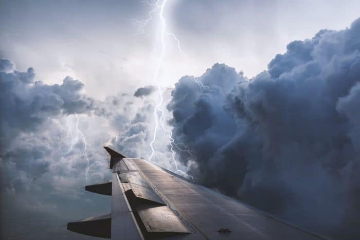 Airplane wing view thunderstorm
