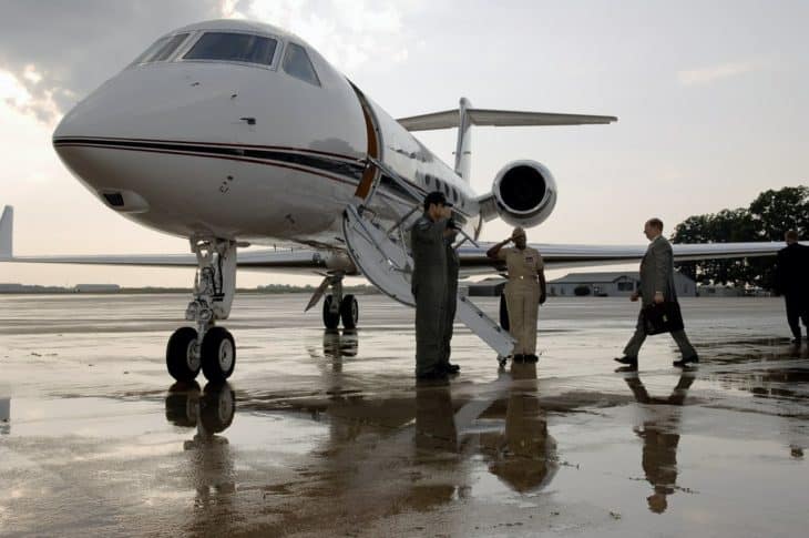 Business man boarding a private jet