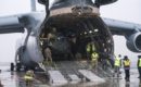 Lockheed C 5M Super Galaxy unloading Sikorsky Blackhawks to Riga airport