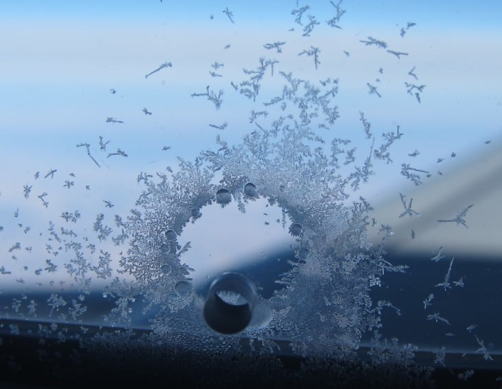 Airplane window hole and ice ring cropped