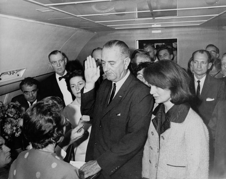 Lyndon B Johnson taking the oath on board Air Force One