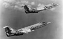 A formation of two U.S. Air Force Lockheed F 104A 15 LO Starfighters in flight.