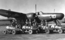 A group of Ohio Marines serving with the 1st Marine Aircraft Wing in Korea are shown in front of a U.S. Marine Corps Grumman F7F 3N Tigercat in December 1950.