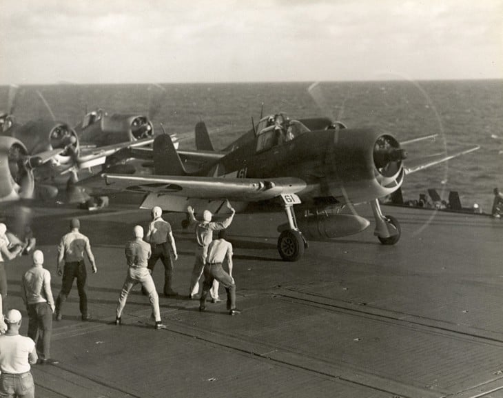 Grumman F6F 3 Hellcat flown by Commander Joseph C. Clifton prepares to launch from the USS SARATOGA