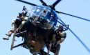 Soldiers from the 75th Ranger Regiment descend in an MH 6 Little Bird.