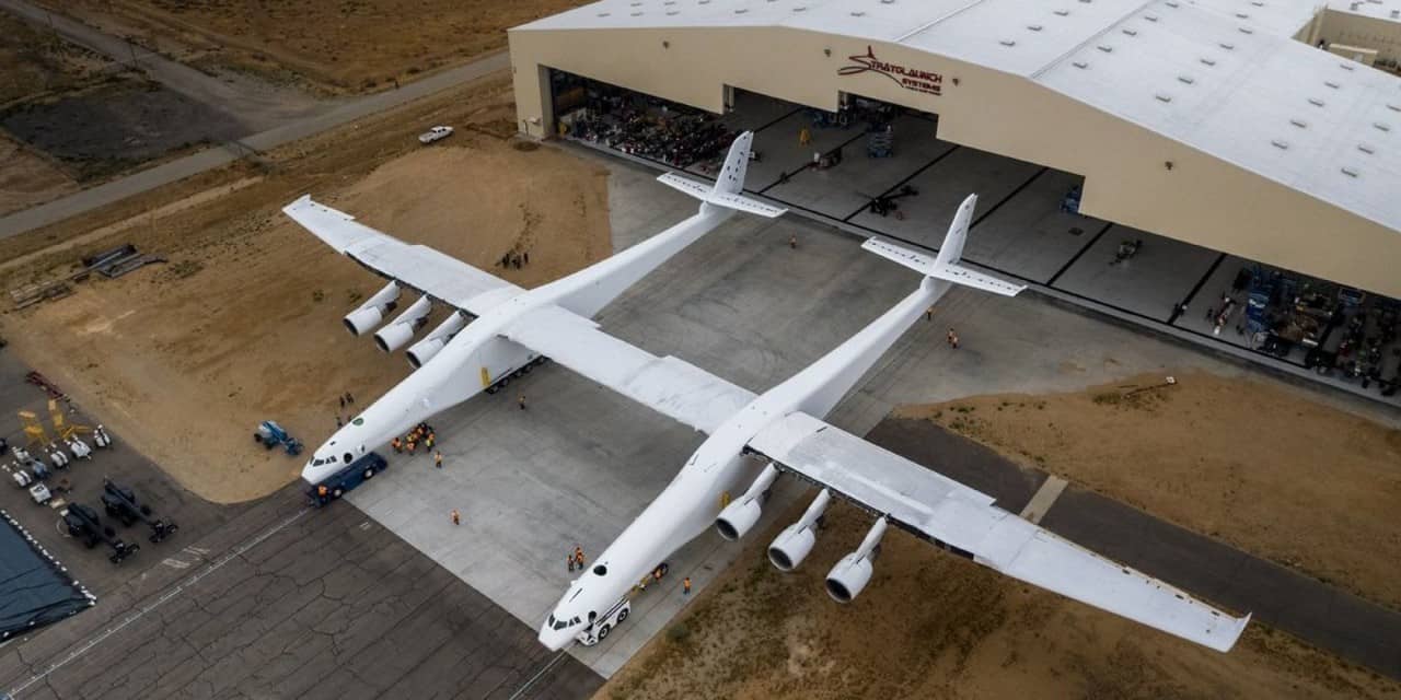 Stratolaunch Roc twin-fuselage aircraft outside its hangar at Mojave Air and Space Port