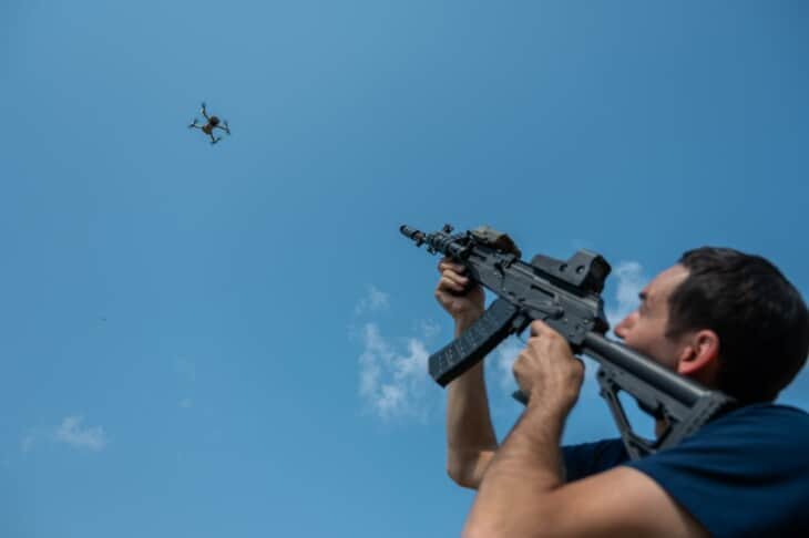 Shooting down flying drone with a rifle