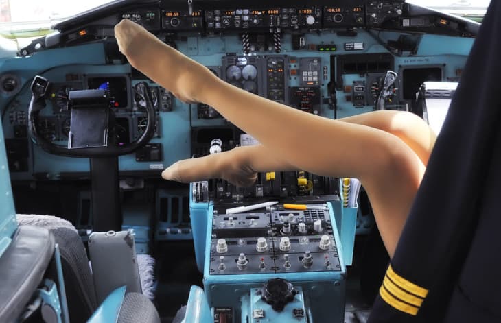 Legs of woman in the cockpit