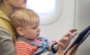 Mother and baby son on board of airplane