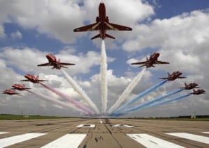 The Red Arrows performing a low level flypast over 04 threshold at RAF Scampton