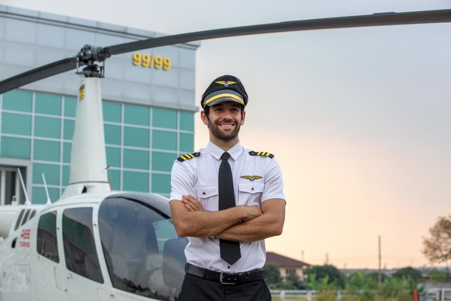 Helicopter pilot in front of helicopter