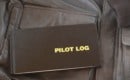 Pilots log sits on top of a leather A4 aviator jacket
