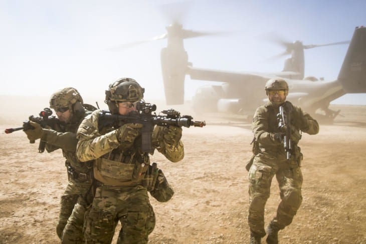 A joint special forces team moves together out of an Air Force CV 22 Osprey aircraft Feb. 26 2018