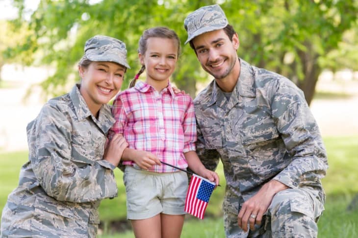military couple with their daughter