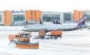 Snowplow removing snow from runways and roads in airport during snow storm in SHEREMETYEVO airport