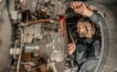 aviation maintenance technician working on engine