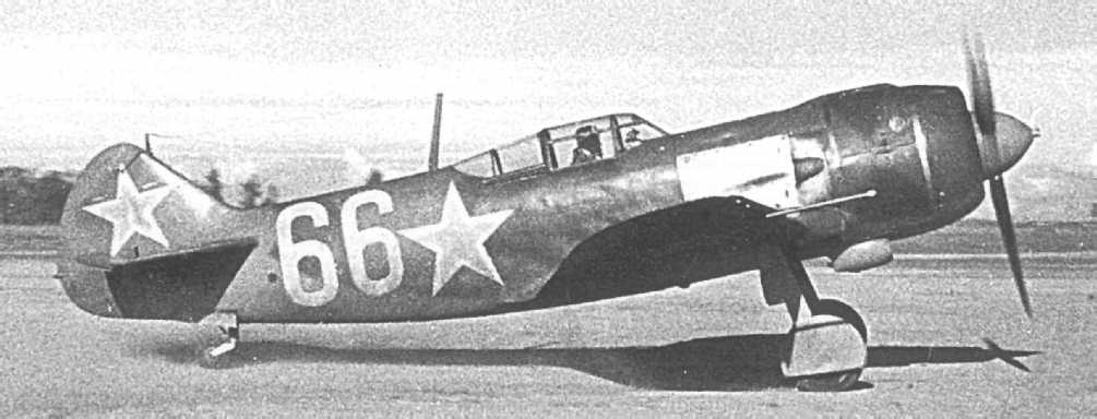 Lavochkin La-5 fighter numbered 66 parked on an airfield in a wartime photo