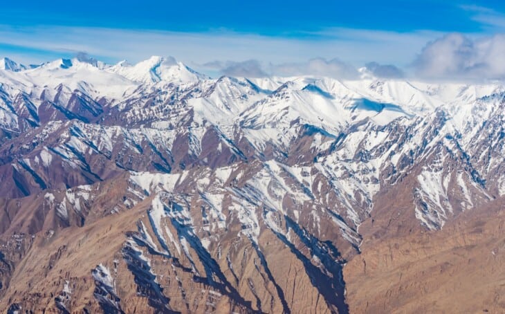 himalaya mountains as seen from a flight in india