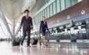 pilot and stewardess walking in airport