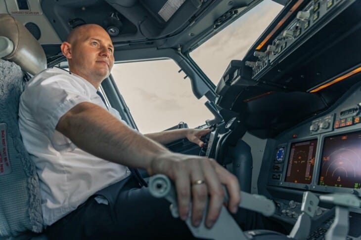 smiling pilot in cockpit