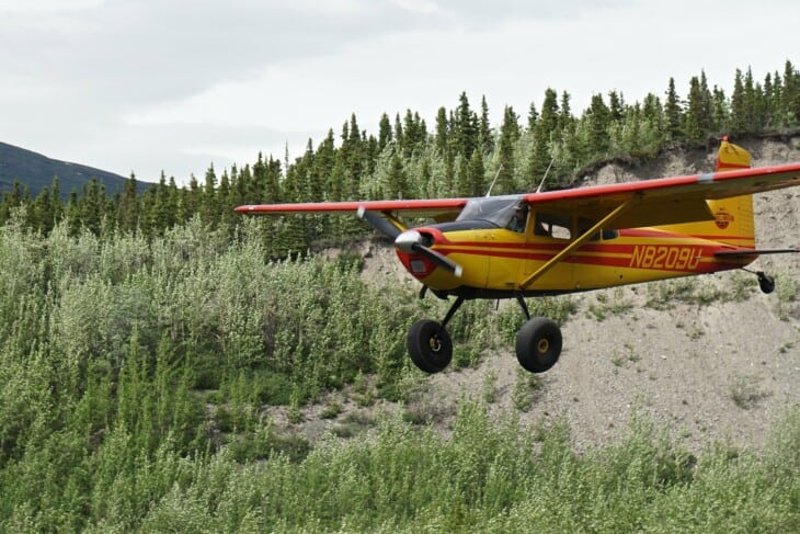 cessna 185 bush plane flying in alaska