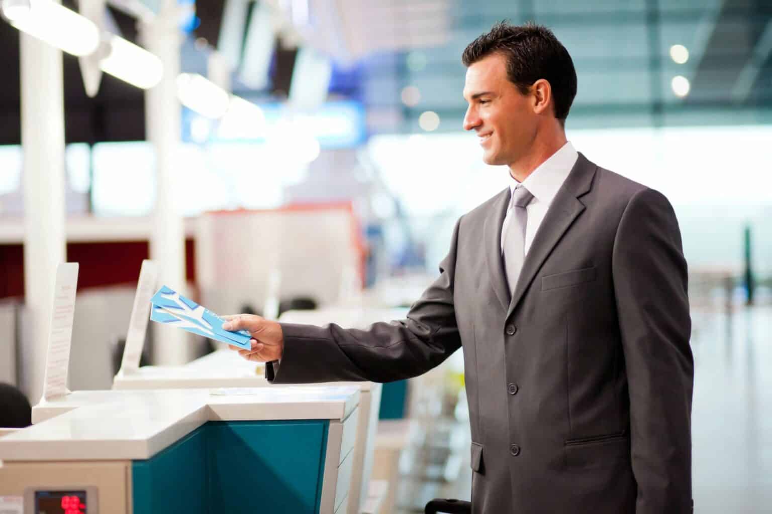 man at airline ticket counter