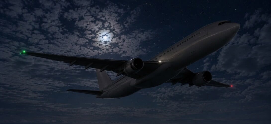 Airbus A330 wide body aircraft in level cruise flight over the Atlantic Ocean at night