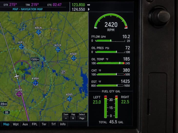 Garmin G1000 multi-function display showing the engine indication system data column with RPM, oil pressure, oil temperature, and fuel quantity readouts in normal green ranges