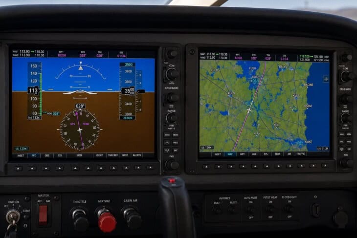 Garmin G1000 glass cockpit showing the Primary Flight Display with attitude, airspeed and altitude tapes on the left and the Multi-Function Display with navigation map on the right