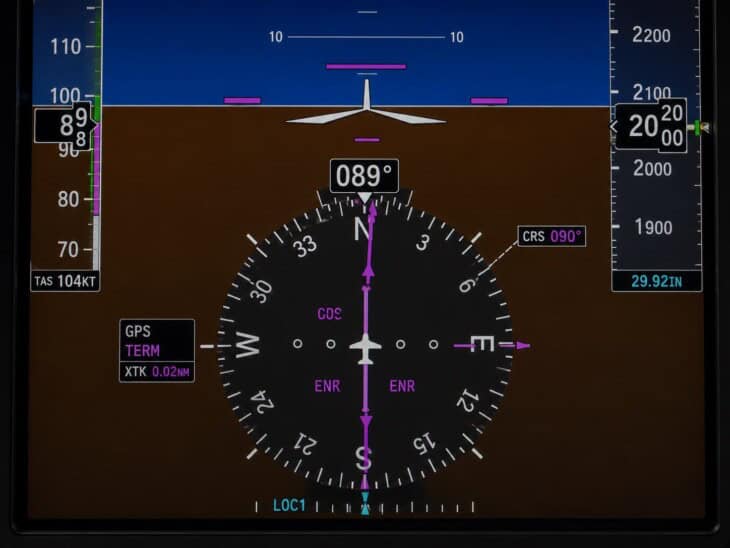 Garmin G1000 primary flight display showing the horizontal situation indicator with rotating compass rose, heading readout, and course deviation bar at the bottom of the screen