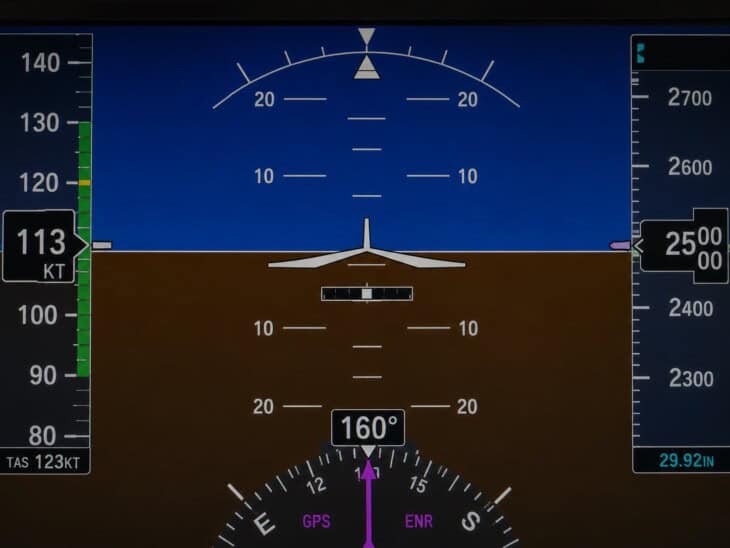 Garmin G1000 primary flight display showing the artificial horizon with the slip/skid indicator bar visible beneath the miniature aircraft symbol, currently centred