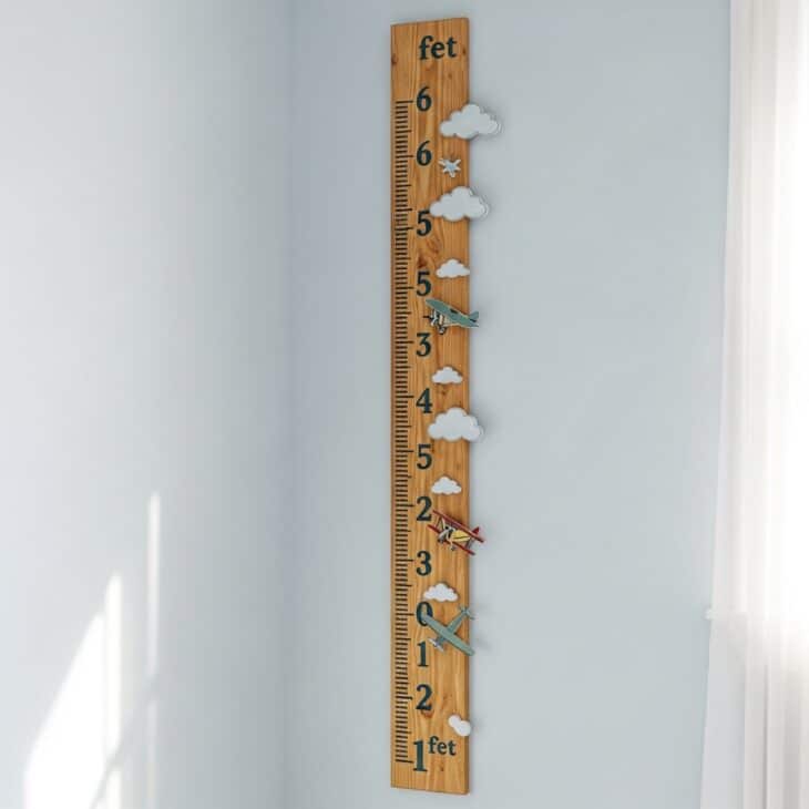 Wooden growth chart styled as an altitude scale with climbing airplane icons