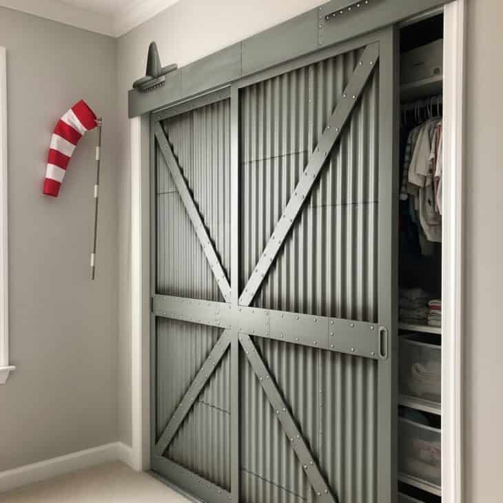 Nursery closet doors painted to look like a metal aircraft hangar