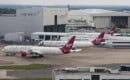 Boeing 787-9 Virgin Atlantic Airways at London Heathrow. Maintenance hangars in background.