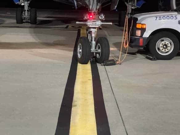 N247BZ nose wheel positioned prior to the RON ramp spot R6 stop bar