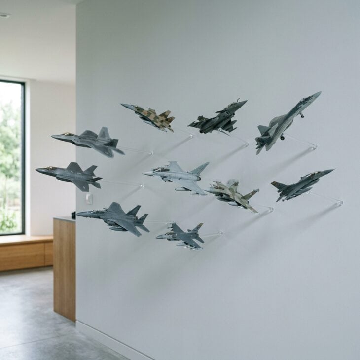 Clear acrylic rods make models look like they are flying straight off the wall.