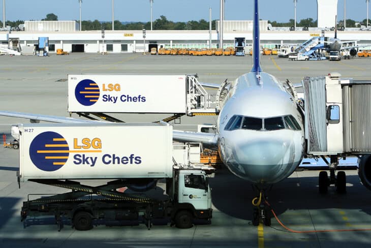 Airbus A320 200 Lufthansa with two catering trucks
