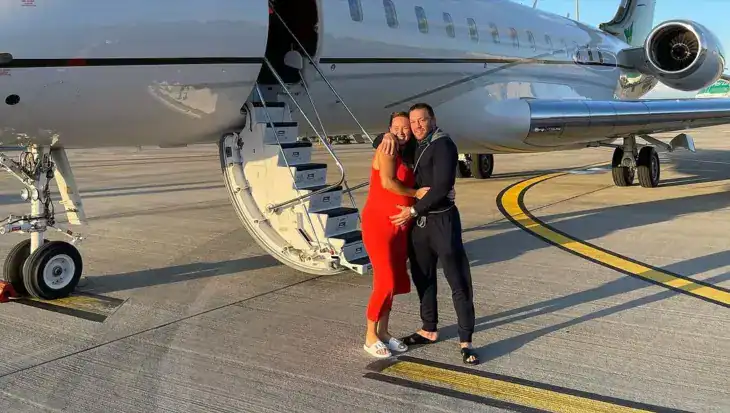 Conor McGregor in front of Bombardier Global Express XRS along with pregnant fiancee Dee Devlin
