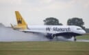 G-ZBAS Monarch Airlines Airbus A320-214 arriving in the rain