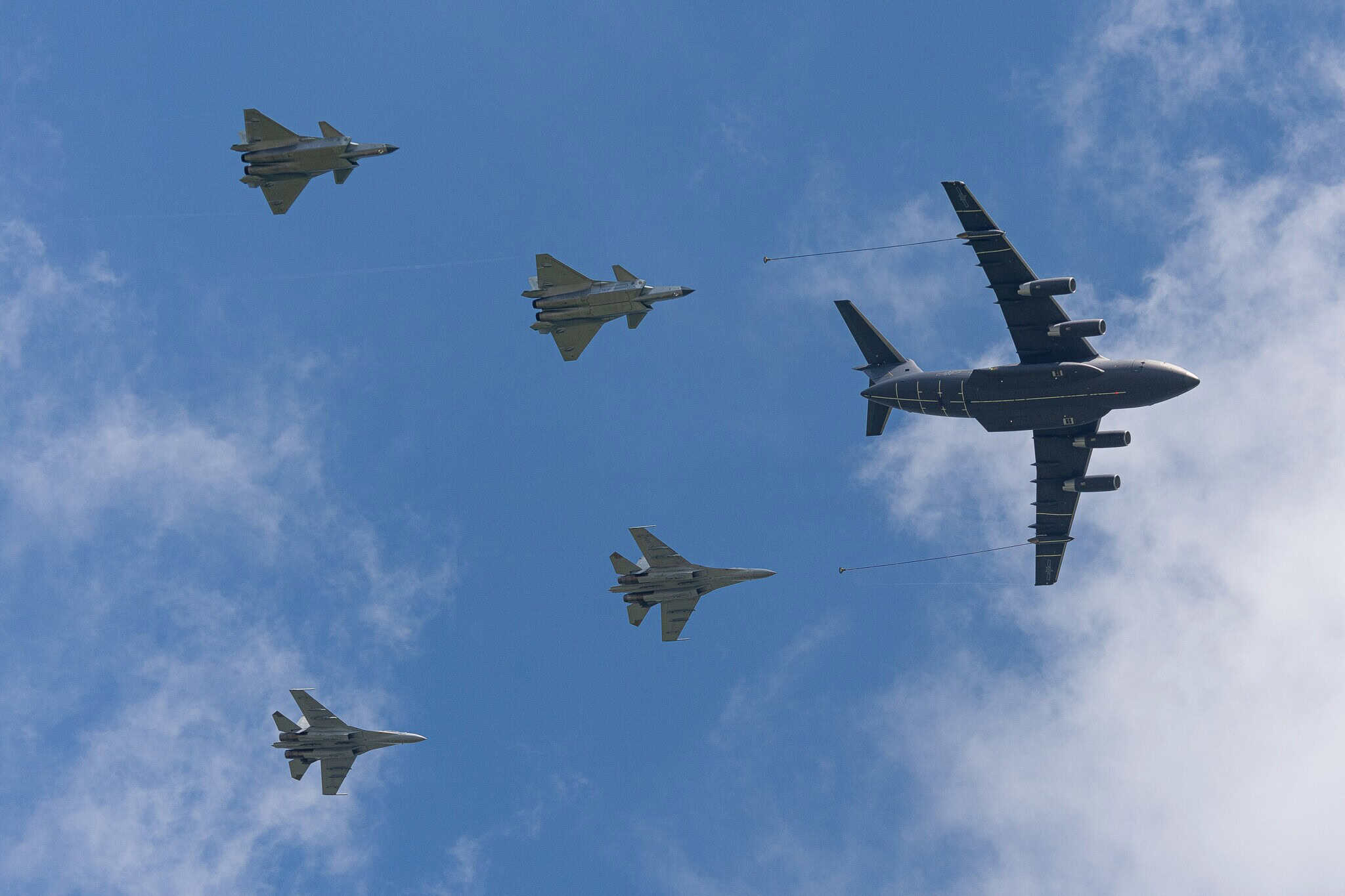 Shenyang J 16 and Chengdu J 20 multirole fighters along with tanker aircraft Xian YY 20 in an aerial refueling formation