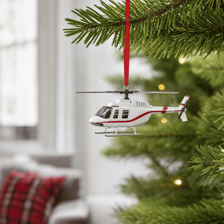 A plain white and red die-cast helicopter varies the tree's shapes beyond fixed-wing planes.