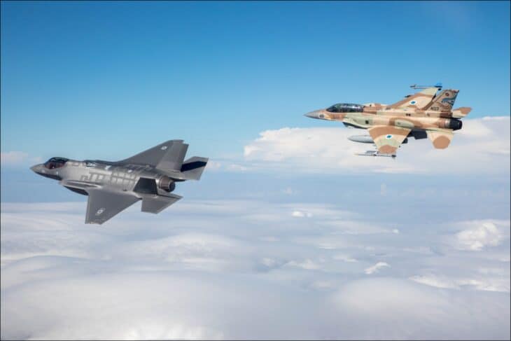 Israeli Air Force F-35I Adir stealth fighter flying above cloud alongside an F-16I Sufa