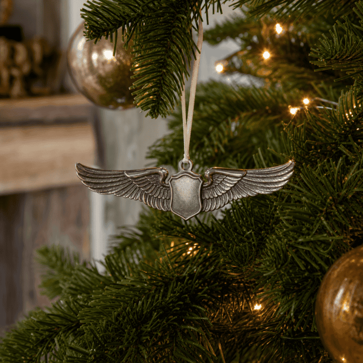 A silver pilot wings badge ornament carries fine feather-etched detail.