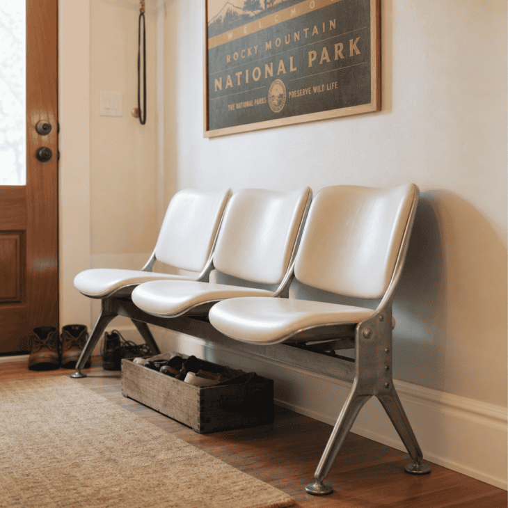 A row of terminal-style bucket seats gives the entryway somewhere to sit.