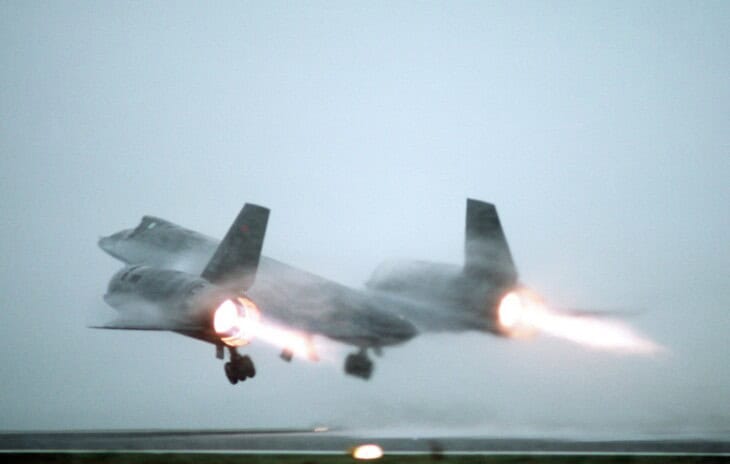 A U.S. Air Force Lockheed SR 71A Blackbird taking off from a fog shrouded runway