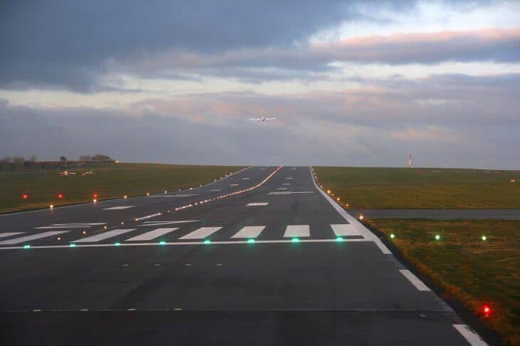 Bristol Airport sloped runway with runway lights in early morning