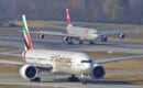 Emirates Boeing 777-300ER A6-EBQ (and Swiss Airbus A340 in the background)