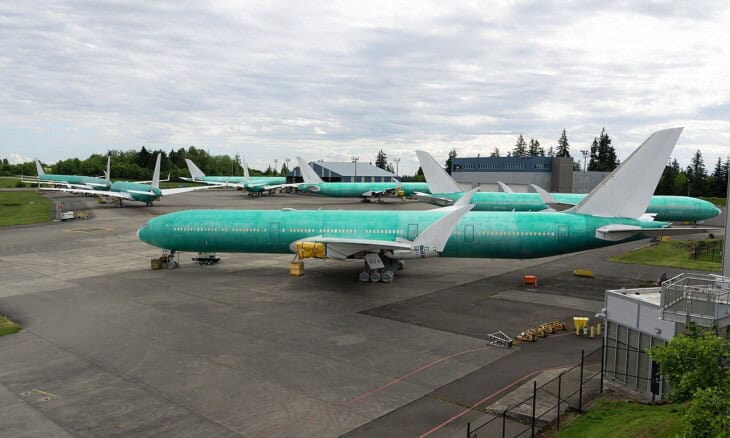 Several Boeing 777-9X (777X) parked in primer on the Everett flight line at Paine Field