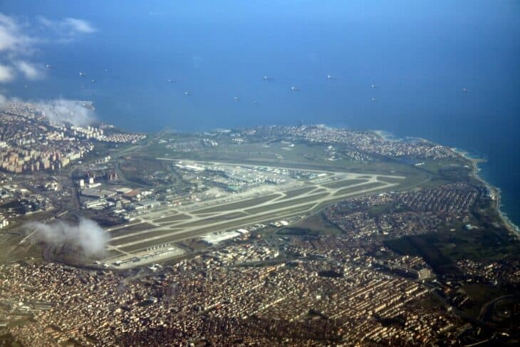 Aerial view of Istanbul Atatürk Airport's runways surrounded by the city